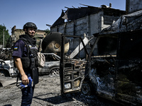 A rescue worker is looking at the damage from the July 8 Russian missile attack in Vilniansk, Zaporizhzhia region, southeastern Ukraine, on...