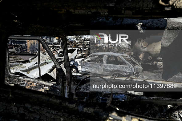 Burnt-out cars are being pictured after the July 8 Russian missile attack in Vilniansk, Ukraine, on July 9, 2024. NO USE RUSSIA. NO USE BELA...