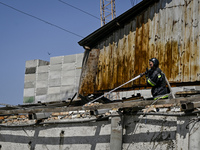 A firefighter is putting out a fire in a building damaged by the July 8 Russian missile attack in Vilniansk, Zaporizhzhia region, southeaste...