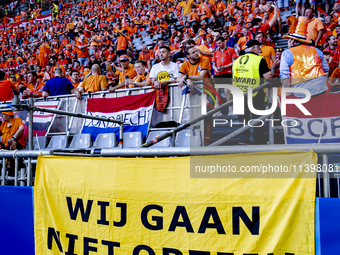 A banner reading ''Wij gaan niet opzij'' is being displayed during the match between the Netherlands and England at the BVB Stadion Dortmund...