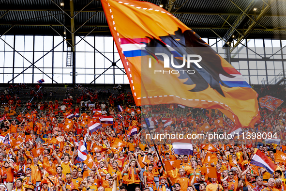 Supporters of the Netherlands are cheering during the match between the Netherlands and England at the BVB Stadion Dortmund for the Semi-fin...