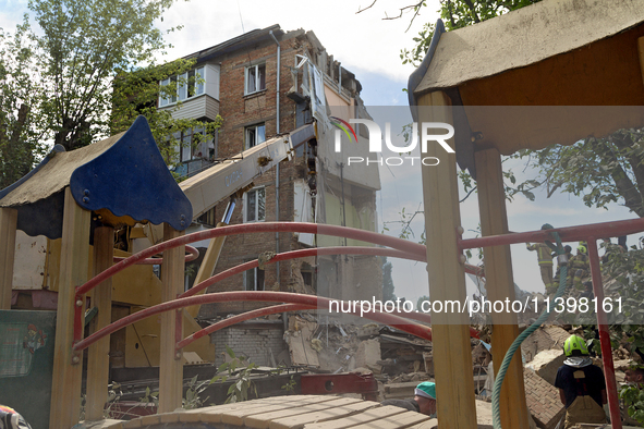 A five-storey apartment building in the Shevchenkivskyi district is being destroyed by a Russian missile attack in Kyiv, Ukraine, on July 8,...