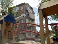 A five-storey apartment building in the Shevchenkivskyi district is being destroyed by a Russian missile attack in Kyiv, Ukraine, on July 8,...