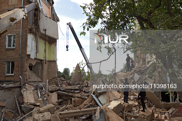 A five-storey apartment building in the Shevchenkivskyi district is being destroyed by a Russian missile attack in Kyiv, Ukraine, on July 8,...