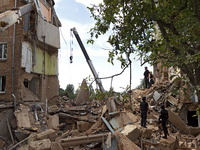 A five-storey apartment building in the Shevchenkivskyi district is being destroyed by a Russian missile attack in Kyiv, Ukraine, on July 8,...