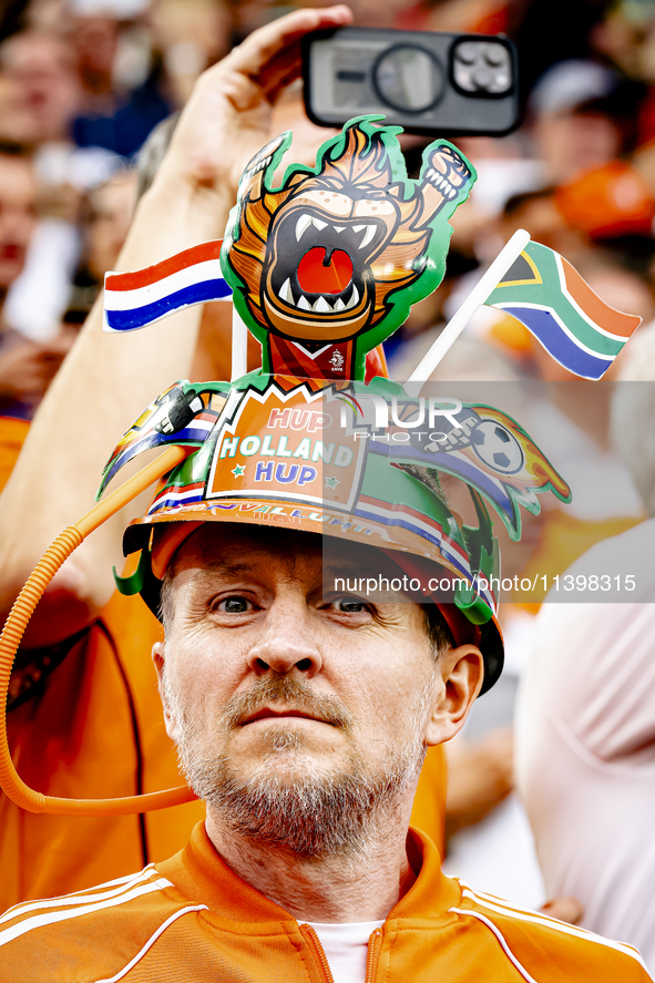 Supporters of the Netherlands are cheering during the match between the Netherlands and England at the BVB Stadion Dortmund for the Semi-fin...