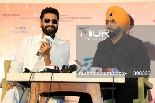 Bollywood actors Vicky Kaushal and Ammy Virk are addressing a press conference during their upcoming movie 'Bad Newz' promotional event in J...