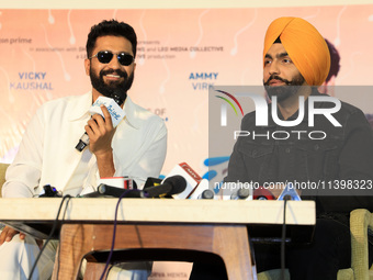 Bollywood actors Vicky Kaushal and Ammy Virk are addressing a press conference during their upcoming movie 'Bad Newz' promotional event in J...