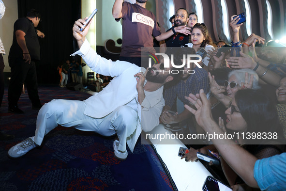 Bollywood actor Vicky Kaushal is taking a selfie with his fans during their upcoming movie 'Bad Newz' promotional event in Jaipur, Rajasthan...