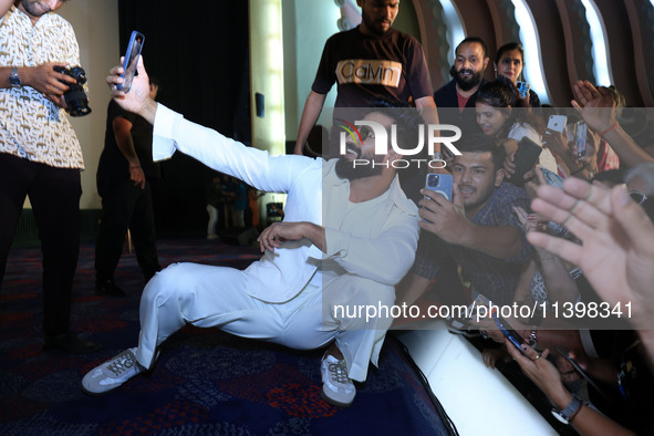 Bollywood actor Vicky Kaushal is taking a selfie with his fans during their upcoming movie 'Bad Newz' promotional event in Jaipur, Rajasthan...