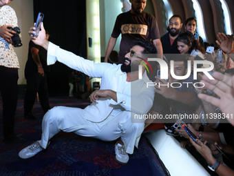 Bollywood actor Vicky Kaushal is taking a selfie with his fans during their upcoming movie 'Bad Newz' promotional event in Jaipur, Rajasthan...