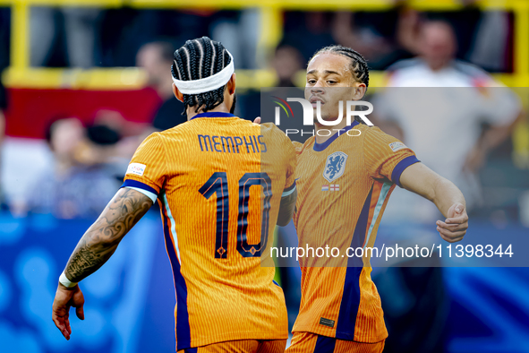 Netherlands forward Xavi Simons is celebrating the goal during the match between the Netherlands and England at the BVB Stadion Dortmund for...