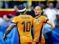 Netherlands forward Xavi Simons is celebrating the goal during the match between the Netherlands and England at the BVB Stadion Dortmund for...