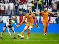 England midfielder Phil Foden and Netherlands midfielder Jerdy Schouten are playing during the match between Netherlands and England at the...