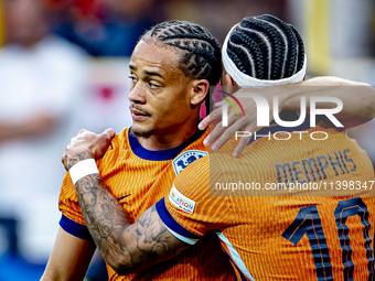 Netherlands forward Xavi Simons is celebrating the goal during the match between the Netherlands and England at the BVB Stadion Dortmund for...