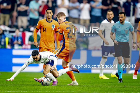 England midfielder Phil Foden and Netherlands midfielder Jerdy Schouten are playing during the match between Netherlands and England at the...