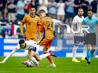 England midfielder Phil Foden and Netherlands midfielder Jerdy Schouten are playing during the match between Netherlands and England at the...