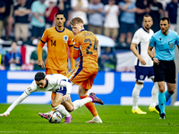 England midfielder Phil Foden and Netherlands midfielder Jerdy Schouten are playing during the match between Netherlands and England at the...