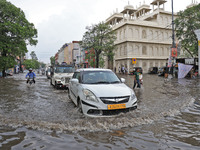 Commuters are wading through a waterlogged road during the monsoon rain in Jaipur, Rajasthan, India, on July 10, 2024. (