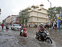 Commuters are wading through a waterlogged road during the monsoon rain in Jaipur, Rajasthan, India, on July 10, 2024. (