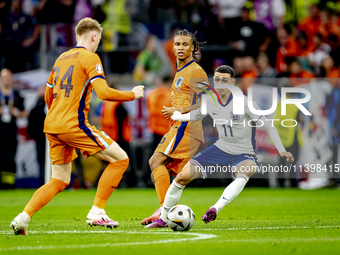 Netherlands midfielder Jerdy Schouten and England midfielder Phil Foden are playing during the match between the Netherlands and England (EU...