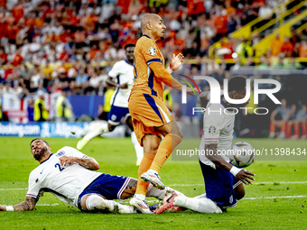 England defender Kyle Walker, England defender Marc Guehi, and Netherlands forward Donyell Malen are playing during the match between the Ne...