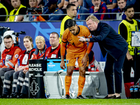 Netherlands midfielder Tijjani Reijnders and Netherlands trainer Ronald Koeman are playing during the match between the Netherlands and Engl...