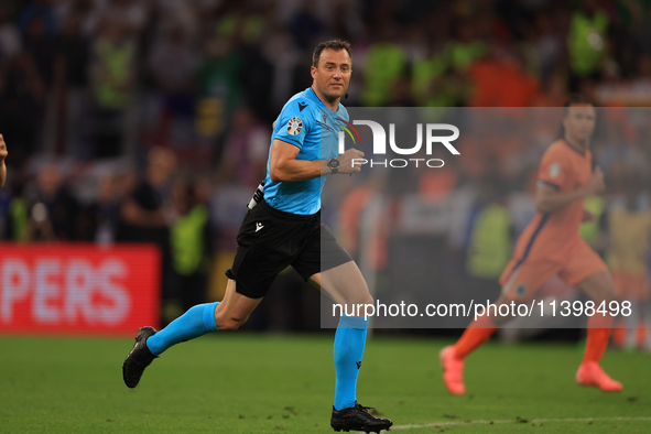 Felix Zwayer, the match referee, is officiating during the Semi Final of the UEFA European Championship between England and Netherlands at t...