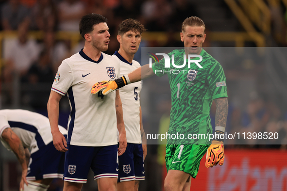 Declan Rice (England) is having heated words with Jordan Pickford (England) during the Semi Final of the UEFA European Championship between...