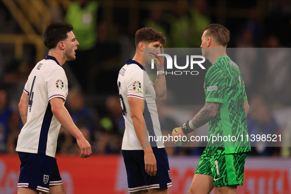 Declan Rice (England) is having heated words with Jordan Pickford (England) during the Semi Final of the UEFA European Championship between...