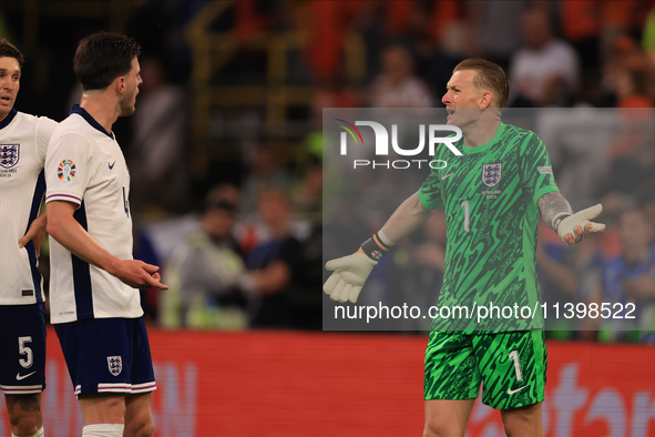 Declan Rice (England) is having heated words with Jordan Pickford (England) during the Semi Final of the UEFA European Championship between...