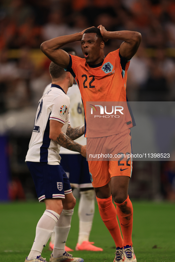 Denzel Dumfries (Netherlands) is hitting the woodwork with a header during the Semi Final of the UEFA European Championship between England...