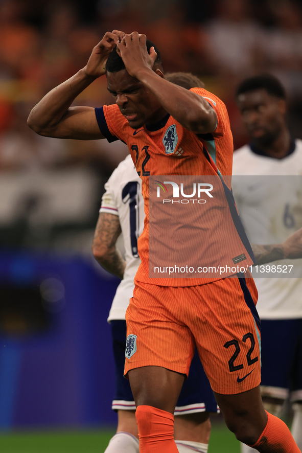 Denzel Dumfries (Netherlands) is hitting the woodwork with a header during the Semi Final of the UEFA European Championship between England...