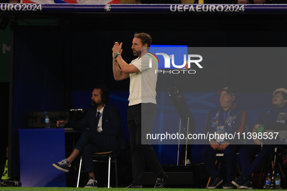 Gareth Southgate, England manager, is applauding during the Semi Final of the UEFA European Championship between England and Netherlands at...