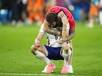 John Stones centre-back of England and Manchester City and Kieran Trippier right-back of England and Newcastle United celebrates victory aft...