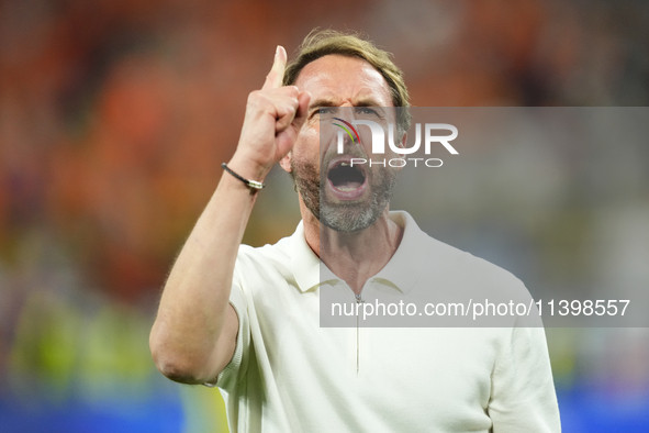 Gareth Southgate head coach of England celebrates victory after the UEFA EURO 2024 semi-final match between Netherlands and England at Footb...