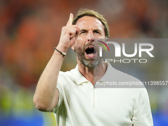 Gareth Southgate head coach of England celebrates victory after the UEFA EURO 2024 semi-final match between Netherlands and England at Footb...