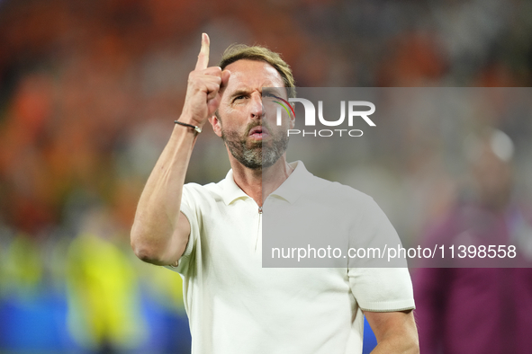 Gareth Southgate head coach of England celebrates victory after the UEFA EURO 2024 semi-final match between Netherlands and England at Footb...