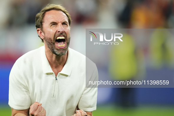 Gareth Southgate head coach of England celebrates victory after the UEFA EURO 2024 semi-final match between Netherlands and England at Footb...