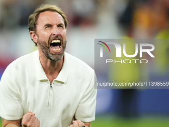 Gareth Southgate head coach of England celebrates victory after the UEFA EURO 2024 semi-final match between Netherlands and England at Footb...