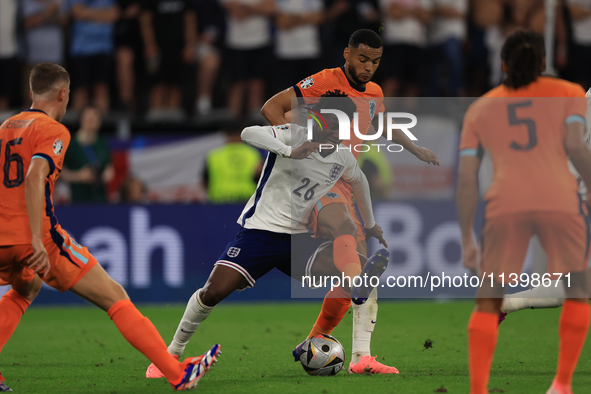 Kobbie Mainoo is being fouled during the Semi-Final of the UEFA European Championship between England and the Netherlands at the BVB Stadion...