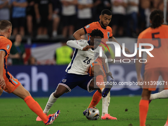 Kobbie Mainoo is being fouled during the Semi-Final of the UEFA European Championship between England and the Netherlands at the BVB Stadion...