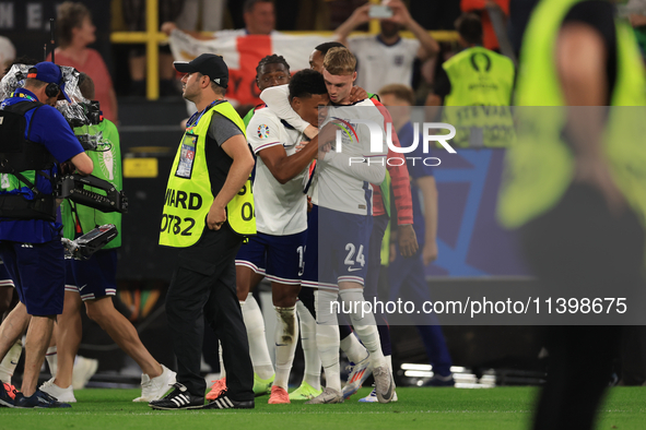 Ollie Watkins (England) is being congratulated by Cole Palmer (England) after the Semi Final of the UEFA European Championship between Engla...