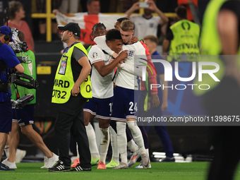 Ollie Watkins (England) is being congratulated by Cole Palmer (England) after the Semi Final of the UEFA European Championship between Engla...