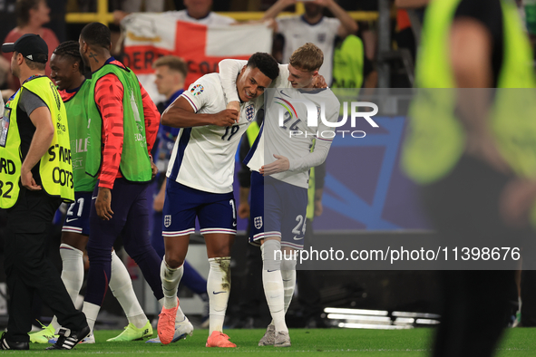 Ollie Watkins (England) is being congratulated by Cole Palmer (England) after the Semi Final of the UEFA European Championship between Engla...