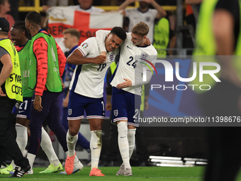 Ollie Watkins (England) is being congratulated by Cole Palmer (England) after the Semi Final of the UEFA European Championship between Engla...