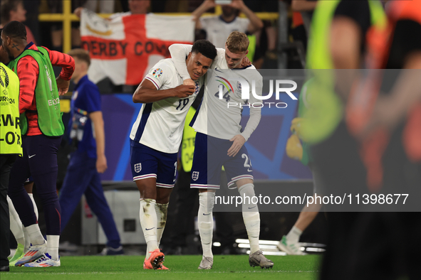 Ollie Watkins (England) is being congratulated by Cole Palmer (England) after the Semi Final of the UEFA European Championship between Engla...