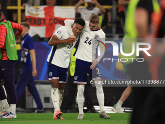 Ollie Watkins (England) is being congratulated by Cole Palmer (England) after the Semi Final of the UEFA European Championship between Engla...