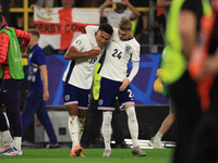 Ollie Watkins (England) is being congratulated by Cole Palmer (England) after the Semi Final of the UEFA European Championship between Engla...