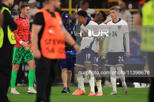 Ollie Watkins (England) is being congratulated by Kobbie Mainoo (England) after the Semi Final of the UEFA European Championship between Eng...